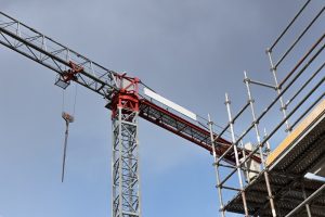 Crane and scaffold on construction site