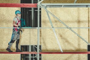 construction worker walking on a scaffold