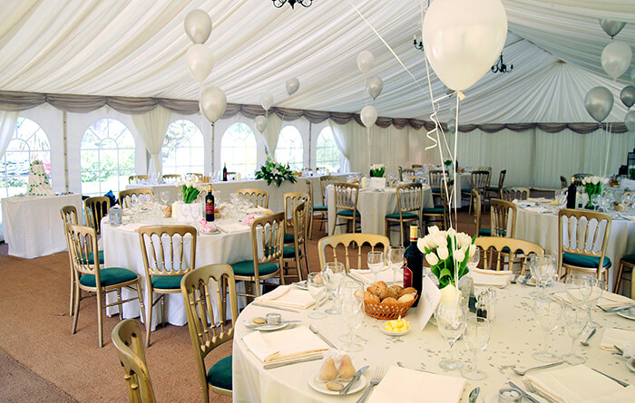 marquee with tables set for party