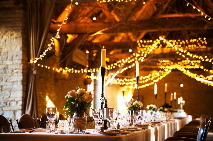 Wedding venue decorated for a party with fairy lights